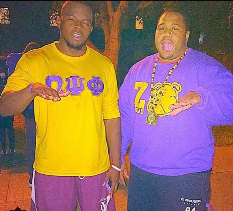 JT wearing Omega Psi Phi letters